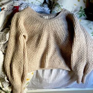 A large, cream, v neck sweater!